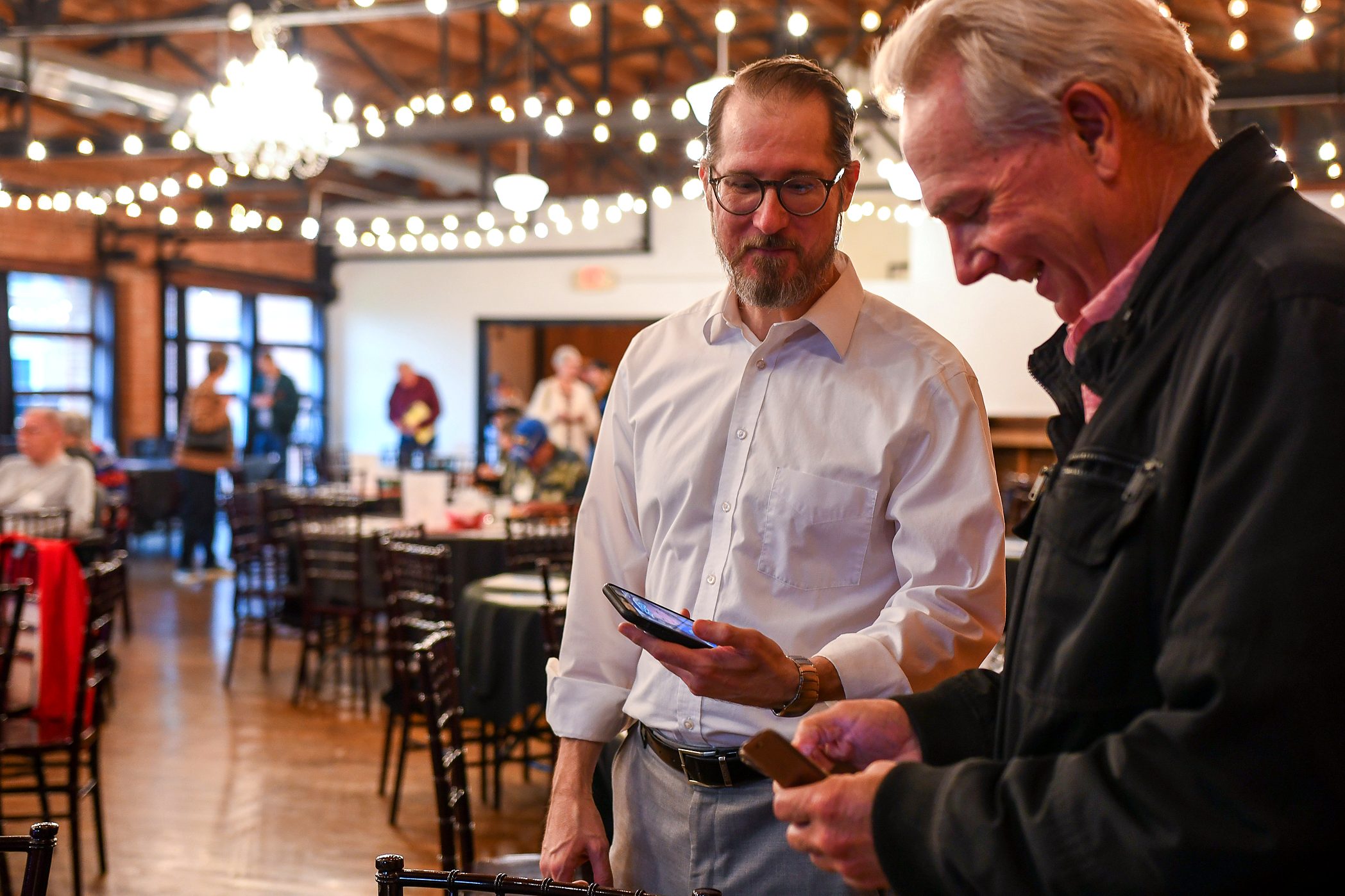 Two guests in conversation at the firm's 2026 annual client meeting