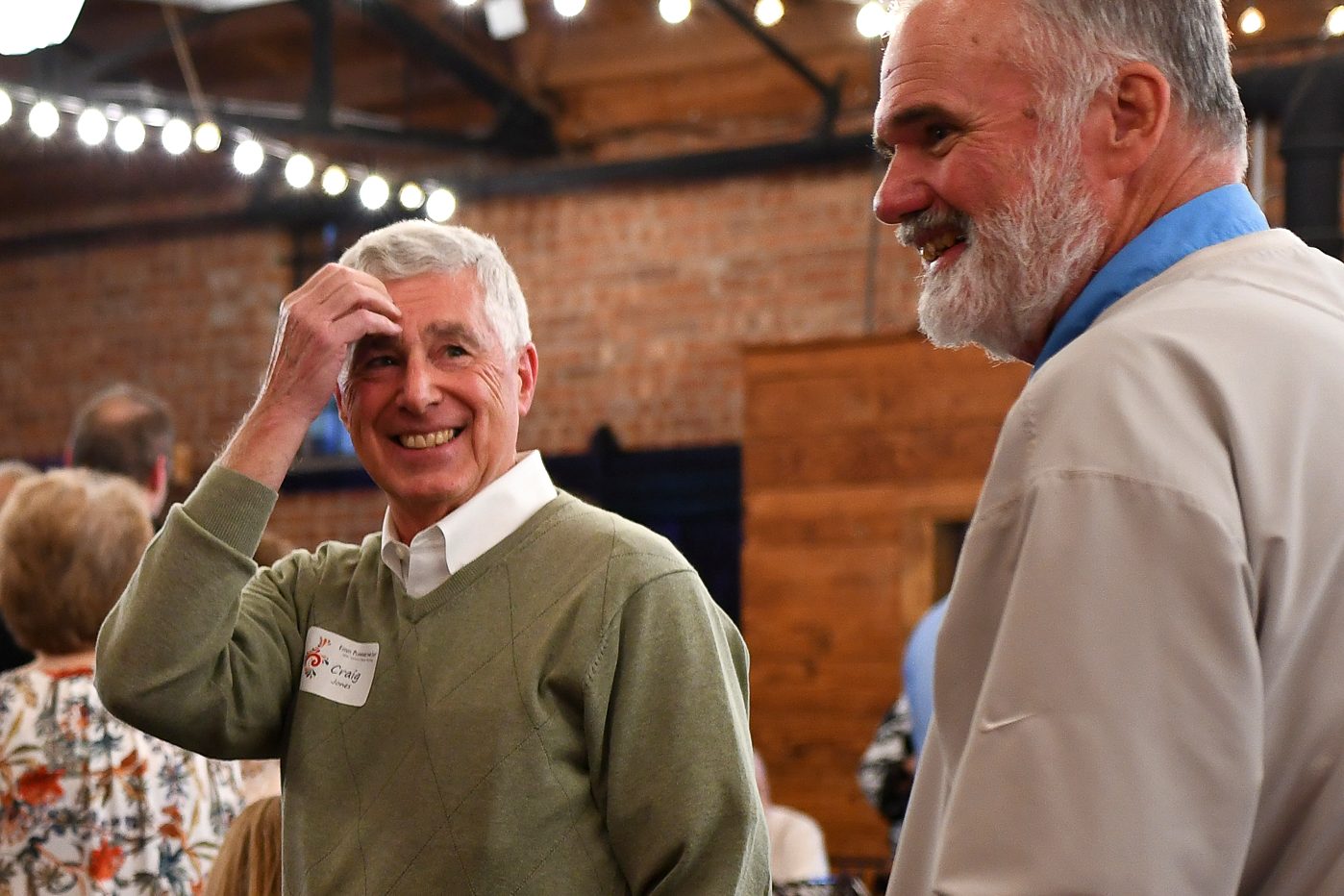 A guest being greeted at the firm's 2026 annual client meeting