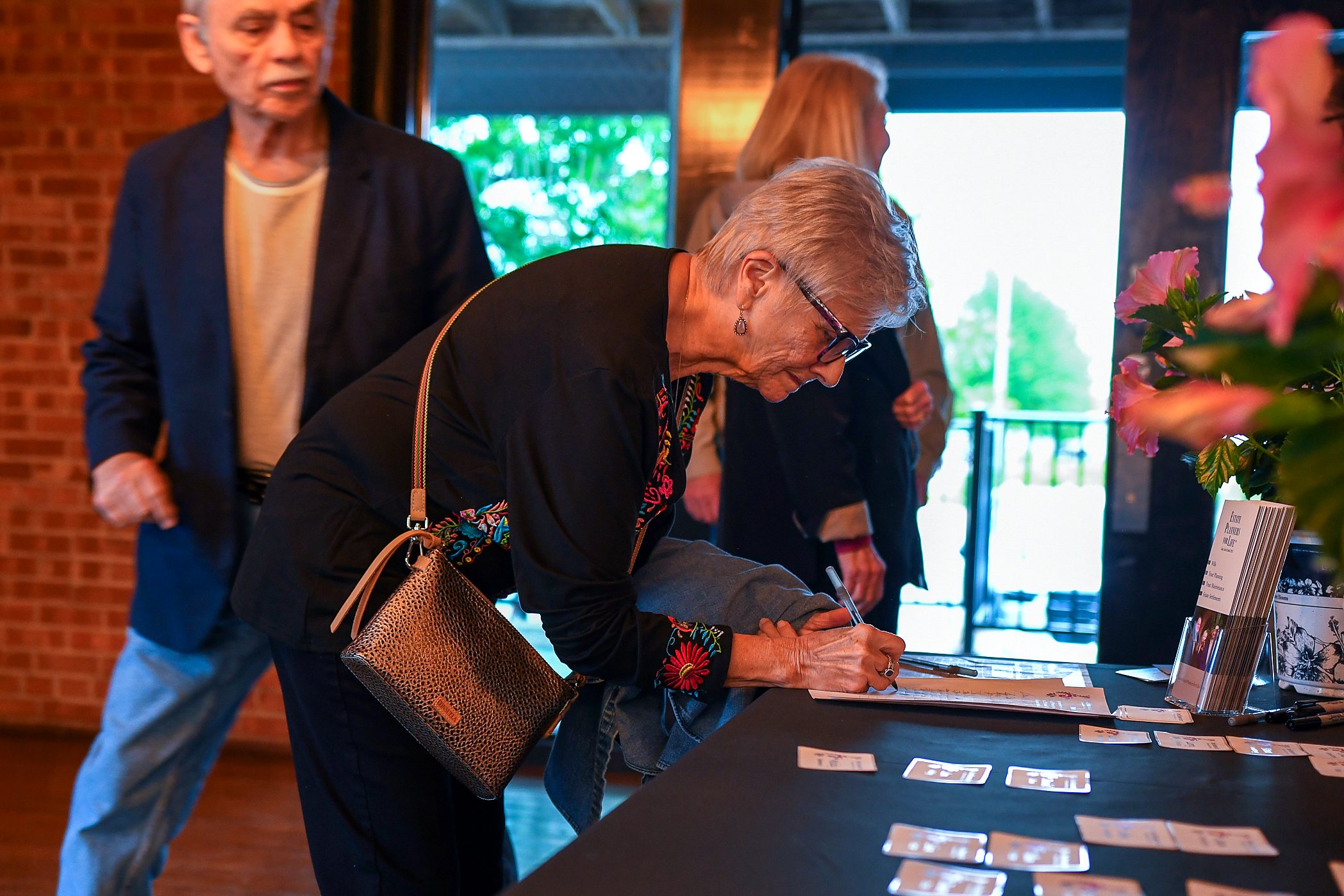 The sign-in table at the firm's 2026 annual client meeting