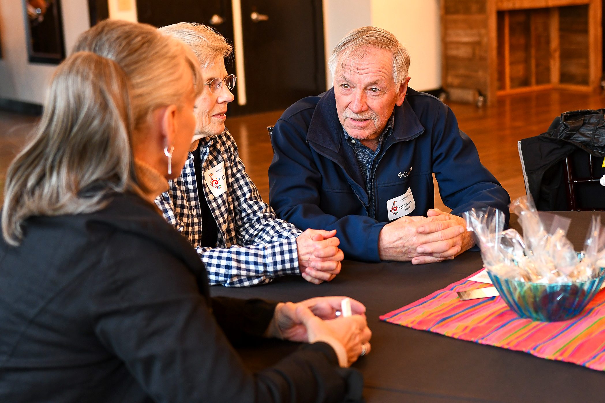 Sitting down with a client couple at the firm's 2026 annual client meeting