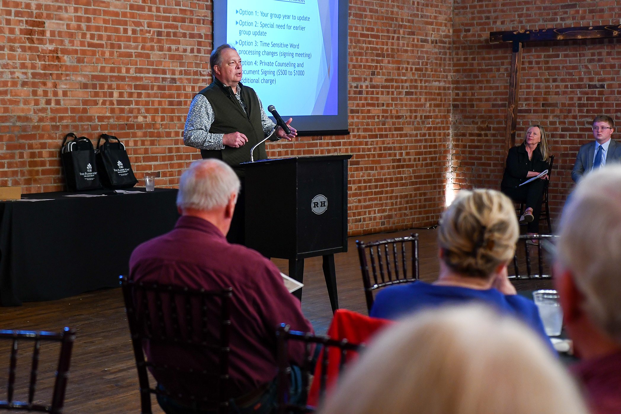 An attorney presenting to the room at the firm's 2026 annual client meeting