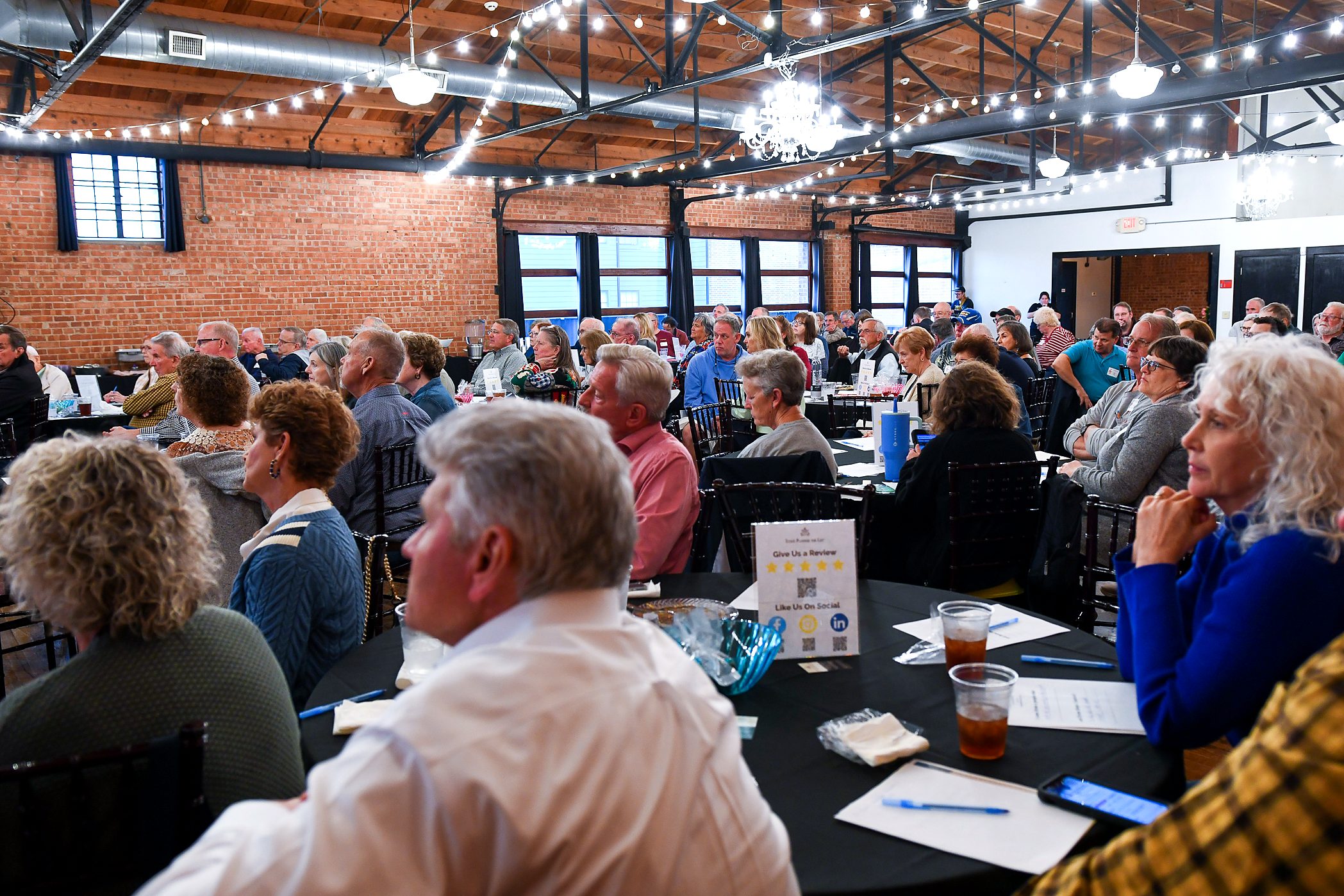 A full room, listening at the firm's 2026 annual client meeting
