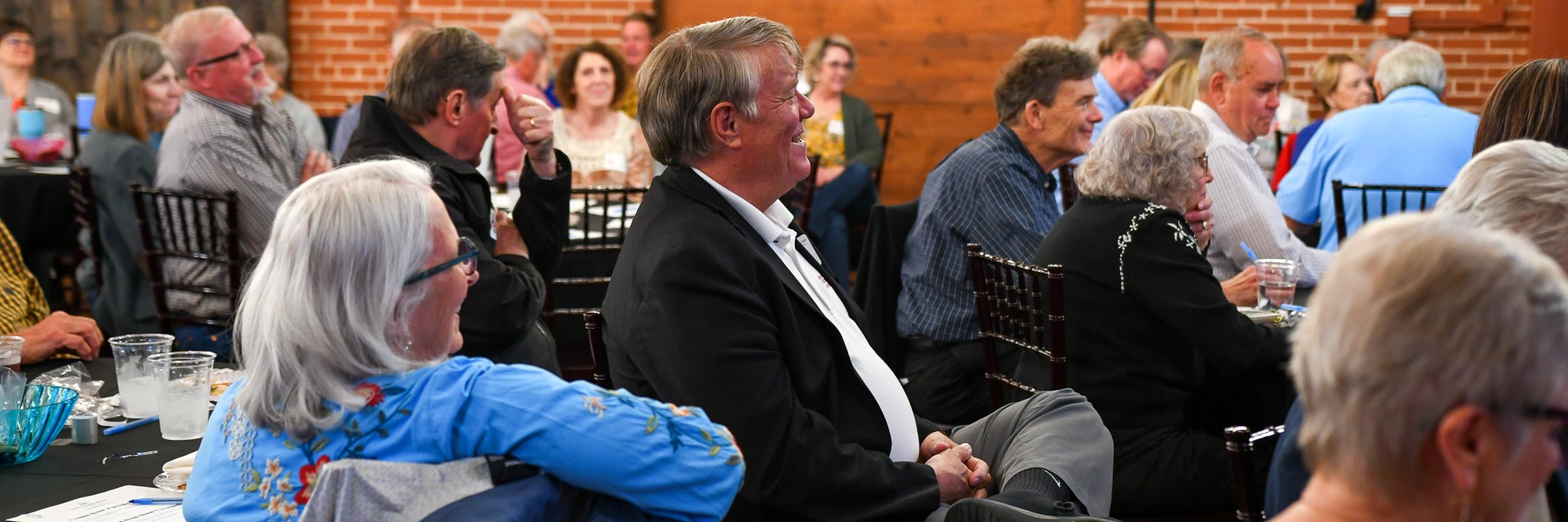 Guests at their tables at the firm&rsquo;s 2026 annual client meeting