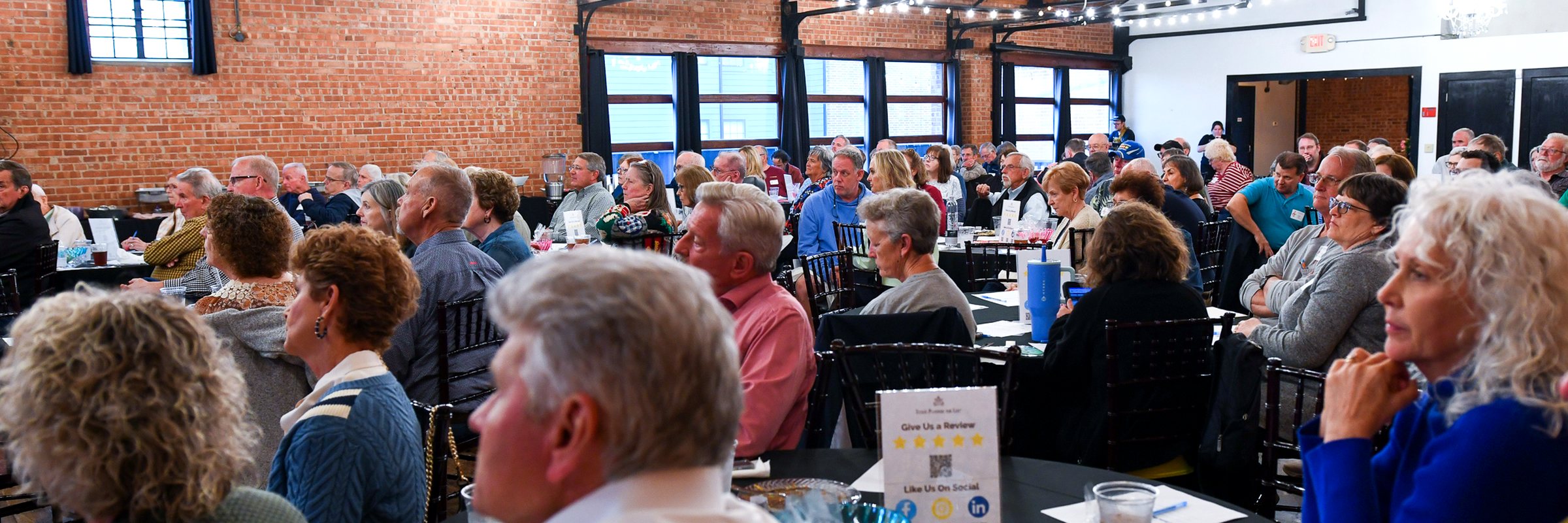 Client families filling the hall at the firm&rsquo;s 2026 annual client meeting