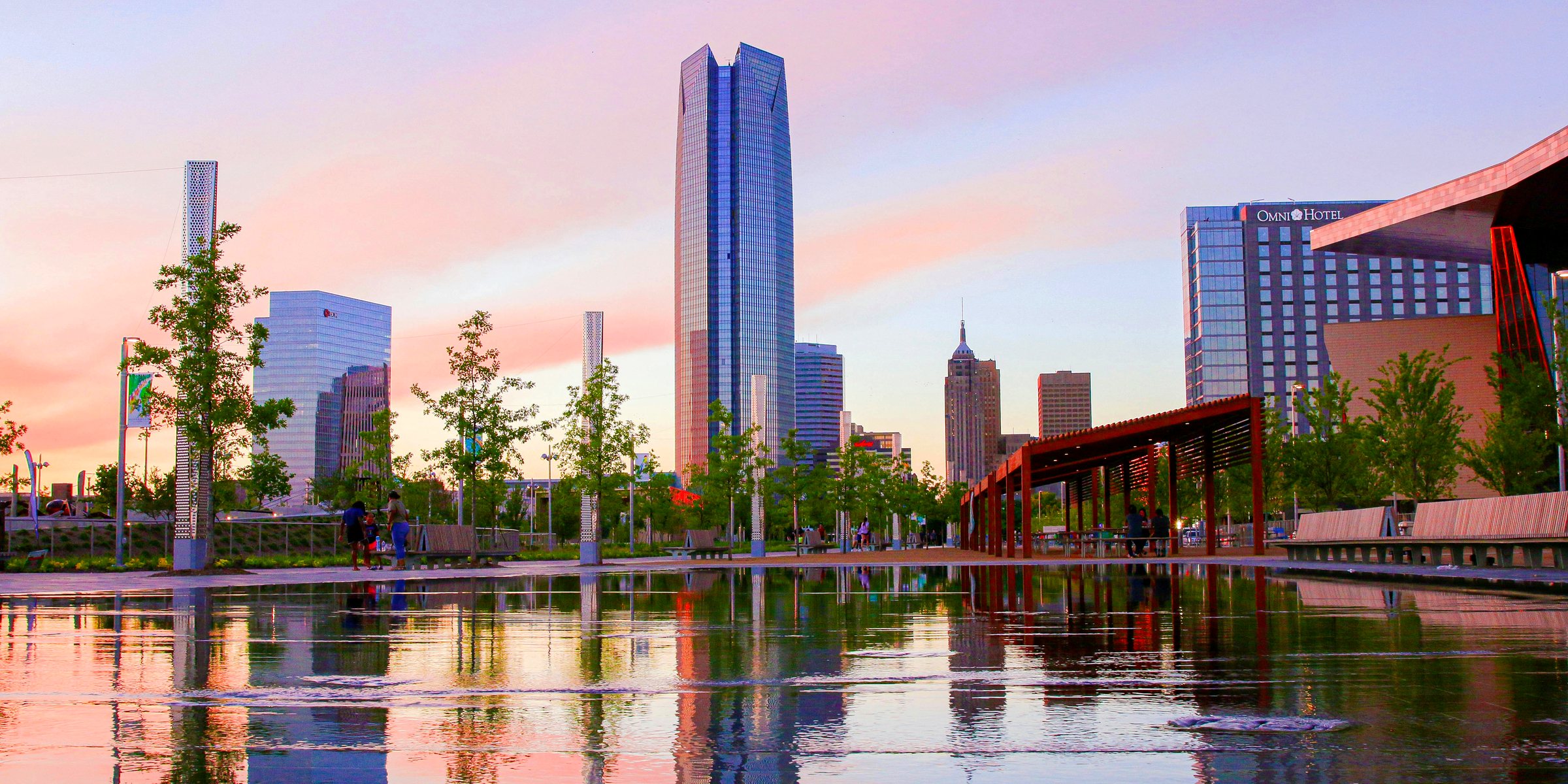 Scissortail Park at sunset, the Devon Tower and the Oklahoma City skyline reflected in the water