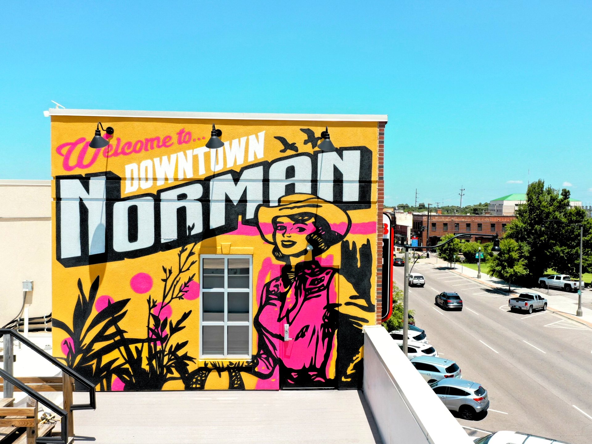 The Welcome to Downtown Norman mural above Main Street